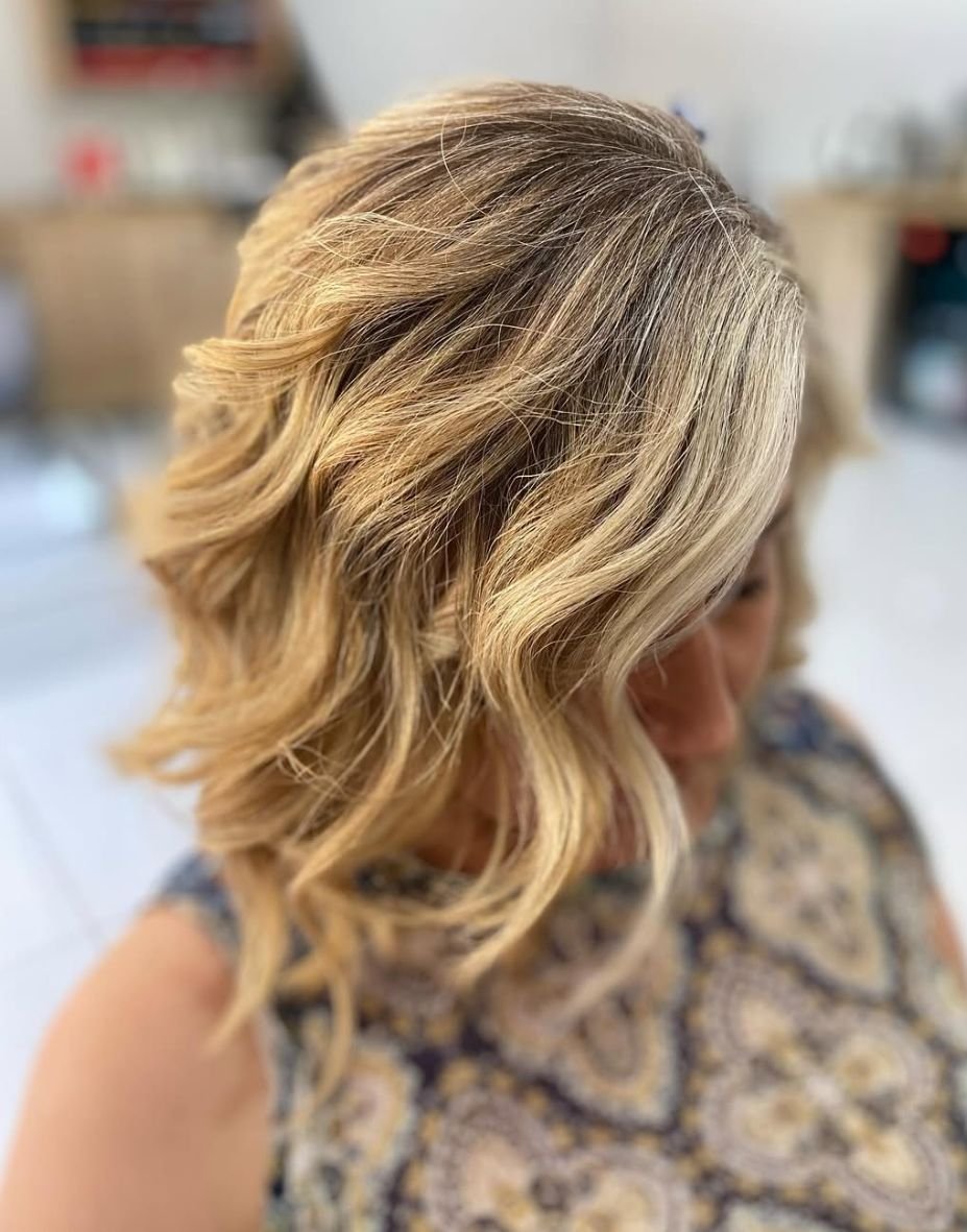 Soft blonde balayage with loose beachy waves
