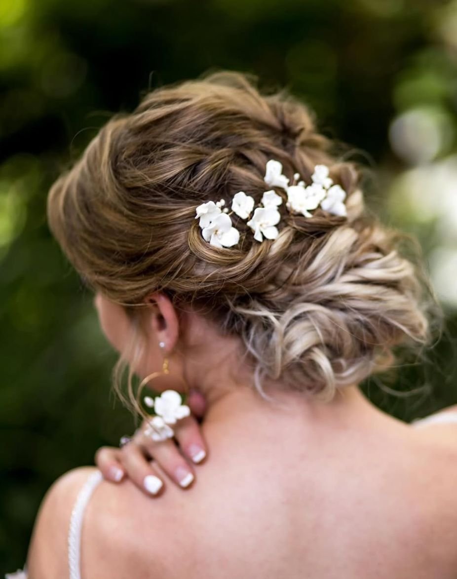 Romantic bridal updo with baby's breath